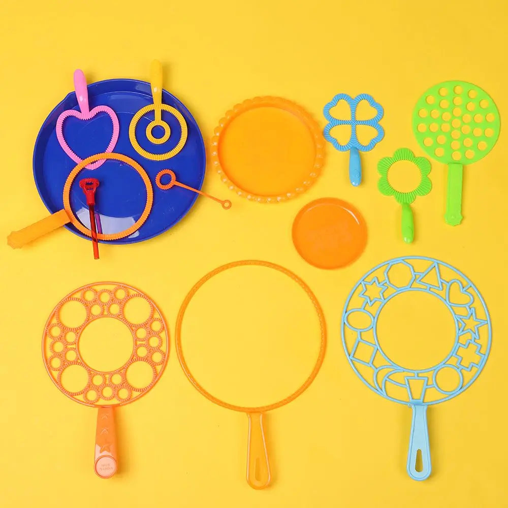 A collection of various colored bubble wands and rings for a party set.