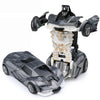A black and white transformable robot car toy featuring a vehicle mode and a robot mode.
