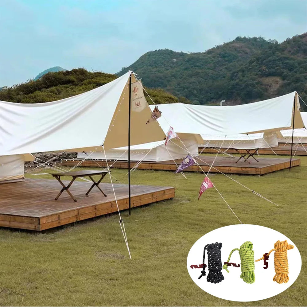 A tent setup for camping featuring reflective guy lines and aluminum tensioners on a wooden platform.