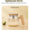 A clear glass mug with a wooden lid and handle is shown on a wooden surface, demonstrating the single cup form.