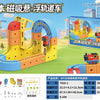 A yellow and blue magnetic building blocks STEM train set featuring anti-gravity vehicles on a green outdoor surface.