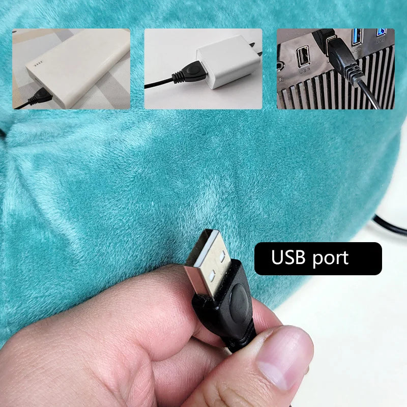 A hand holds a USB port device with a black connector, shown against a teal fleece background.