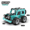 A teal off-road vehicle model built from metal building blocks with large tires and an excavator design.