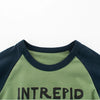A close-up of a dark blue and olive green long sleeve cotton tee with the word INTREPID printed on the front.