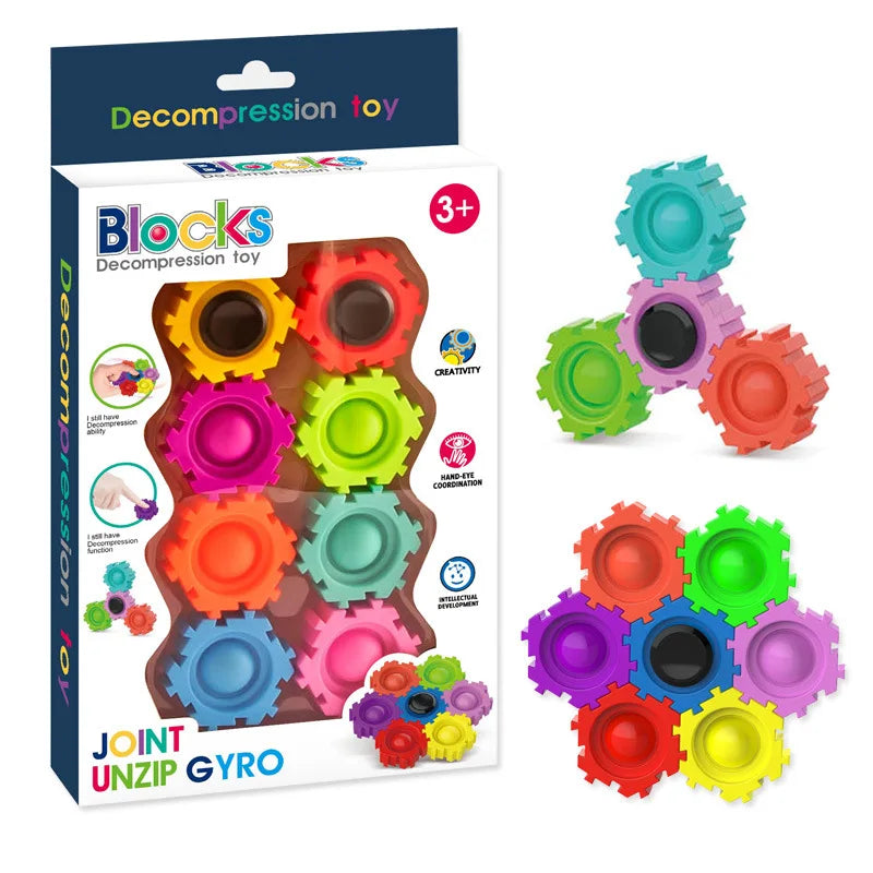 A box of Decompression toy blocks featuring various colored fidget spinners and building pieces.
