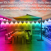 Permanent outdoor LED eaves lights illuminating the contours of a house with colorful light effects.