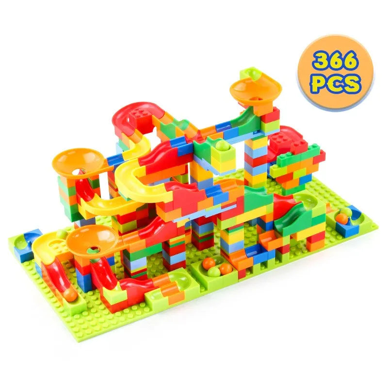 A set of colorful marble race run building blocks featuring funnel slides and ramps.