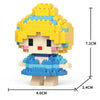 A yellow and blue micro building block figurine of a character with curly hair and a blue dress.