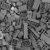 A bulk pack of gray classic building bricks, sorted by color and various sizes.