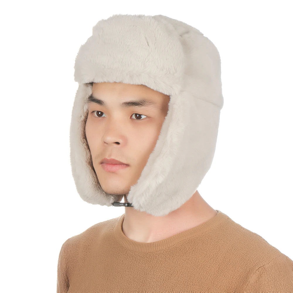 A man wearing a light beige fur-lined Russian ushanka trapper hat.