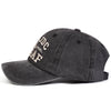 A dark gray washed baseball cap embroidered with the letters IDC SAF.