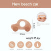 A light wooden car toy with a circular opening, made from natural wood.