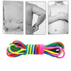 A colorful rainbow elastic jump rope coiled and laid out for active play and fitness.