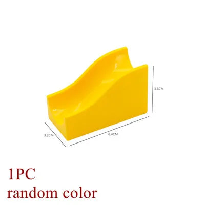 A yellow marble run building block piece with dimensions 3.2cm by 6.4cm and a height of 3.8cm.