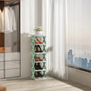 A vertical modular shoe rack with light green shelves holds pairs of shoes near a large window.