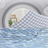 A close-up of a waterproof baby mattress protector with a plaid pattern and blue wavy design.