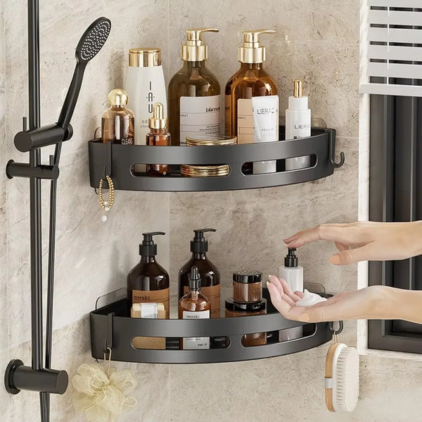 A black adhesive shower caddy and bathroom storage shelf mounted on a wall, holding various bottles and grooming tools.