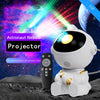A white astronaut projector night light with galaxy effects is shown on a moon surface.