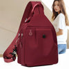 A maroon mini backpack is shown next to a woman, highlighting the bag's design and color.