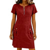 A woman wearing a maroon lightweight cotton-linen short sleeve dress with a collar and front zipper and side pockets.