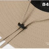 A close-up view of a beige mesh bucket hat with black adjustable strap and a black patch displaying 04: and Fear of Rain.