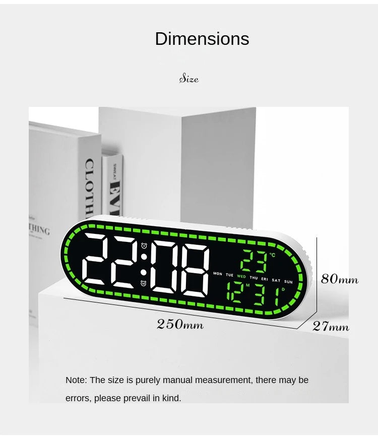 A digital wall clock displaying 22:08, temperature, and date, shown next to a box for size reference.