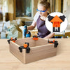 A woman is using adjustable right-angle clamps on a wooden box for woodworking or DIY projects.