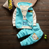 A light blue cartoon fleece pajama set for a child featuring a bear design and a matching hoodie.