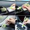 A set of green and white detailing brushes used for cleaning car interiors and exteriors.