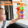 A toddler interacts with a Montessori busy board toy featuring lights and sounds inside a car seat.