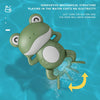 A green wind-up frog toy is shown swimming in blue water, demonstrating an innovative mechanical structure.