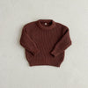 A maroon knit baby pullover sweater with a ribbed texture displayed against a light background.
