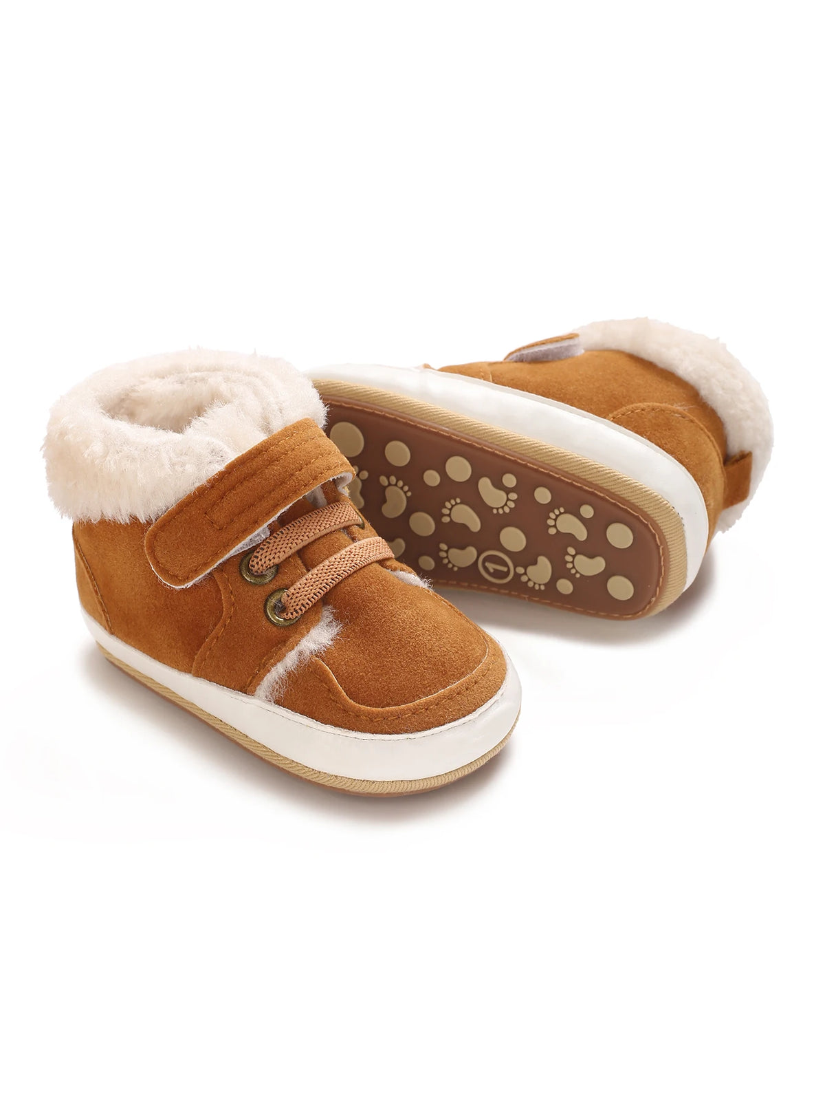 A pair of brown suede baby winter snow boots with fluffy cream-colored shearling lining and a white sole.
