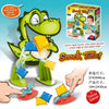 A green dinosaur catapult toy launching colorful snack bags indoors for family fun