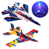 A red and black LED foam glider airplane toy with a blue light effect, shown in flight.