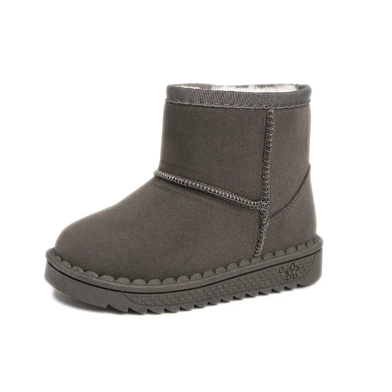 A pair of dark gray kids winter ankle boots with a plush lining and textured sole.