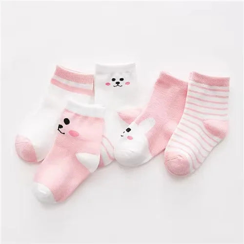 A set of pink and white striped cotton baby socks laid out on a white background.