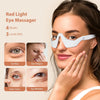 A woman is using a white red light eye massager device on her eye area.