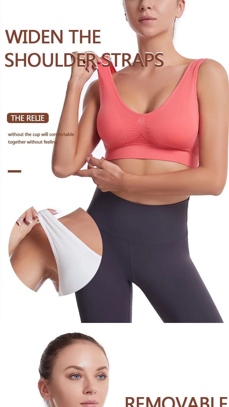 A woman models a coral sports bra with wide shoulder straps, demonstrating its fit and removable design.