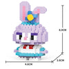 A purple and pink rabbit figurine made of micro building blocks with a yellow eye detail.