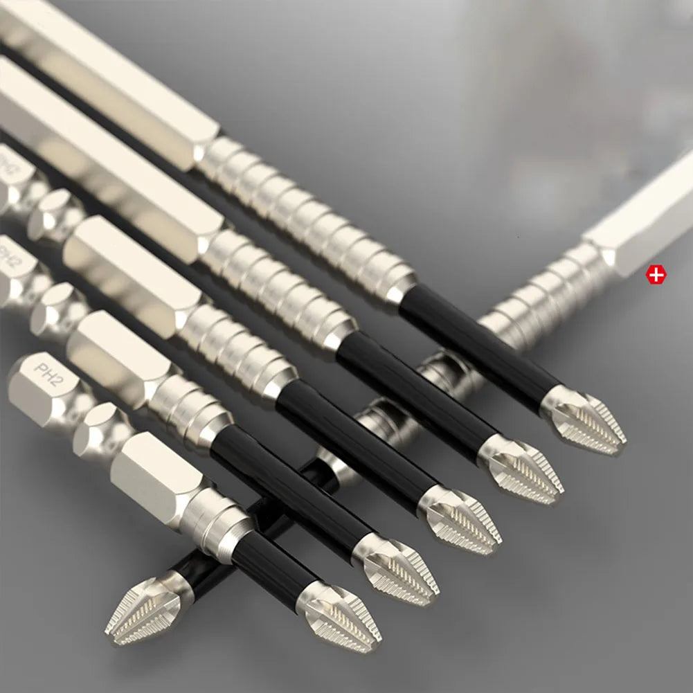 A set of magnetic PH2 screwdriver bits with 1/4 hex shank tools arranged diagonally on a gray surface.