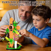 A man and a boy are assembling an orange Jesus cross flower building set on a wooden table.
