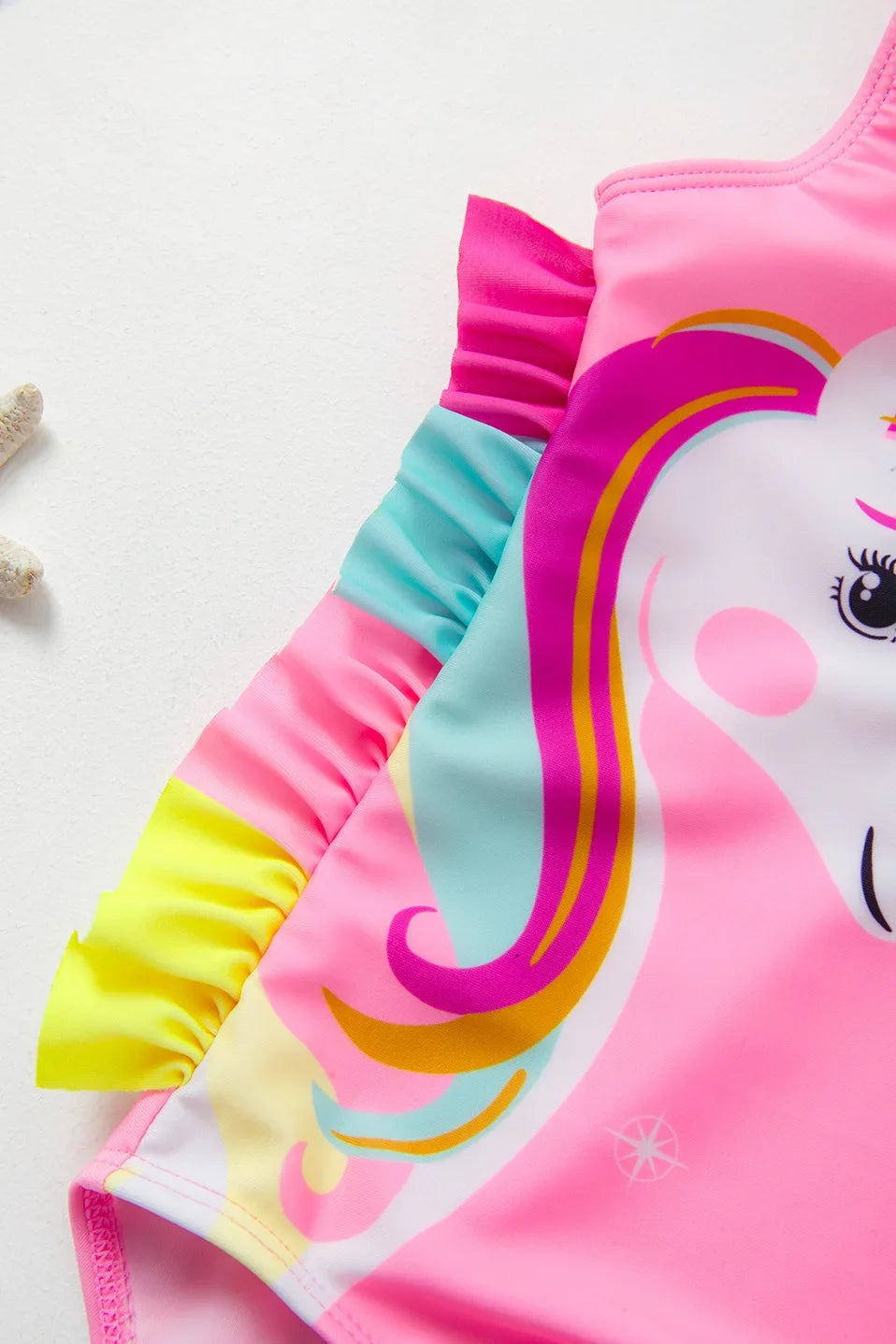 Pink and white kids mermaid unicorn one-piece swimsuit with ruffled trim