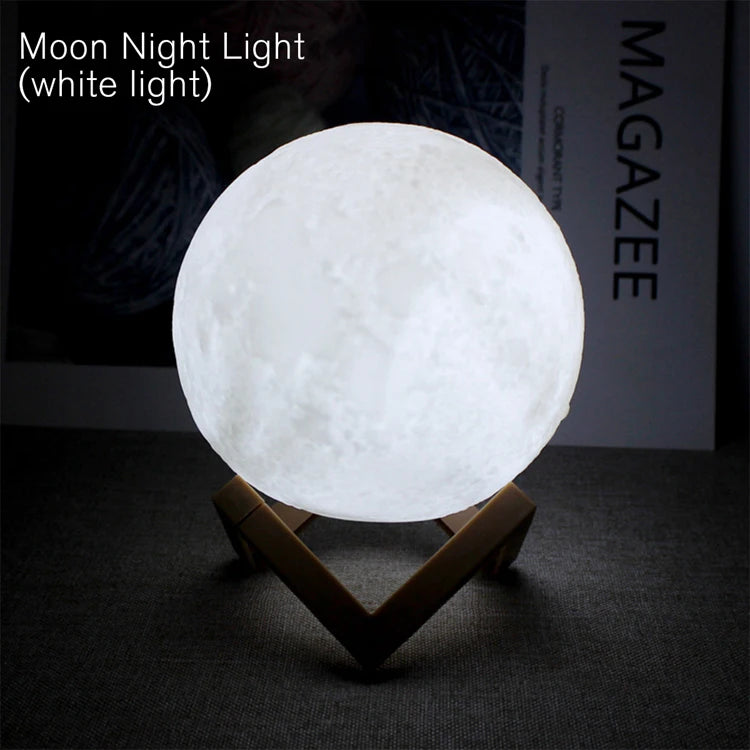 A white light moon night lamp shaped like a sphere resting on a wooden stand.