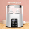 A white multi-function baby bottle warmer and sterilizer appliance with a clear glass chamber.