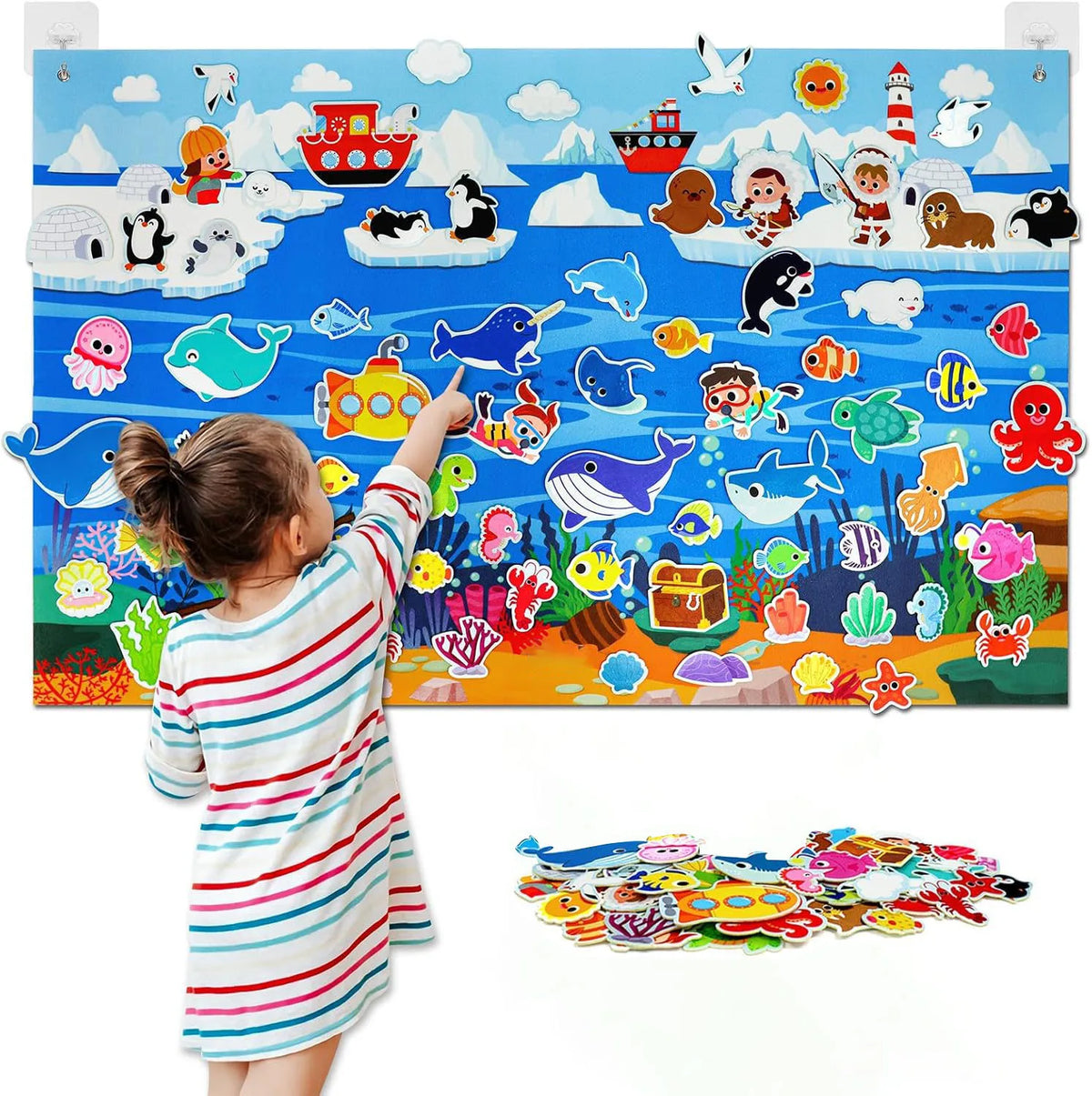 A child interacts with a felt story board featuring various zoo animals and scenes.