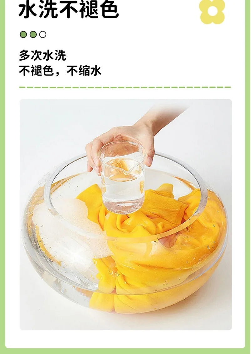 A hand is pouring water into a bowl filled with sliced yellow avocado fruit for washing.