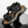 A pair of black men's genuine leather air cushion sandals with woven straps and light brown soles.