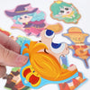 A hand is grasping a colorful puzzle piece featuring an animal character for a finger grasp trainer.