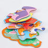 A colorful six-in-one educational puzzle set featuring various animal shapes cut from cardboard.